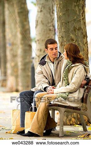 Stock Photo - bag, bench, boulevard, chat. Fotosearch