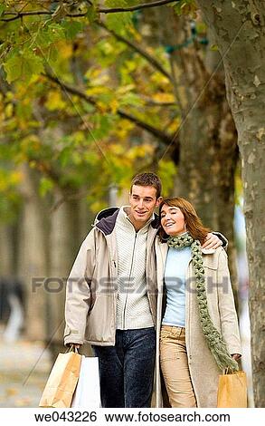 Stock Photograph - bag, boulevard, carry, carrying. Fotosearch