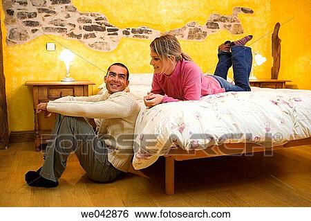 Stock Photograph - bed, bedroom, chat. Fotosearch