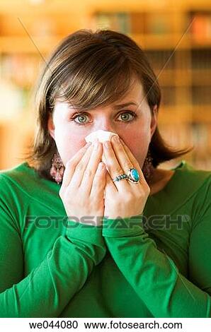 Stock Image - Blow nose, Blowing nose, cold. Fotosearch