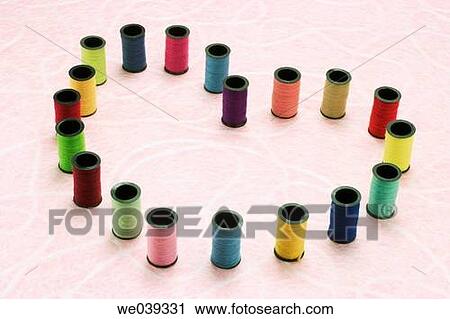 Bobbins in heart shape View Large Photo Image Stock Image - Bobbins in heart shape. Fotosearch