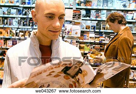 bookshop, browsing, browse, 30's View Large Photo Image Stock Photo - bookshop, browsing, browse, 30's. Fotosearch