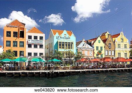 Brightly colored buildings with Dutch colonial architecture line the port in Willemstad, Curacao, Netherland Antilles. View Large Photo Image Stock Image - Brightly colored buildings with Dutch colonial architecture line the port in Willemstad, Curacao, Netherland Antilles.. Fotosearch