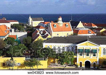 Brightly colored buildings with Dutch colonial architecture line the port in Willemstad, Curacao, Netherland Antilles. View Large Photo Image Stock Image - Brightly colored buildings with Dutch colonial architecture line the port in Willemstad, Curacao, Netherland Antilles.. Fotosearch