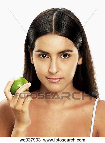 Stock Image - brunette, Citrus fruit, contemporary, dark hair. Fotosearch