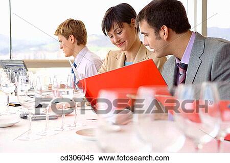 Stock Photography - business, Business lunch, businessman, businesspeople, businesswoman. Fotosearch