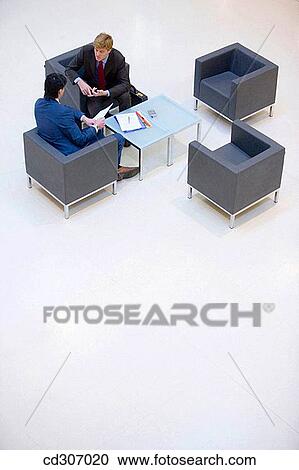 Stock Image - business, businessman, businesspeople, chair, colleague. Fotosearch