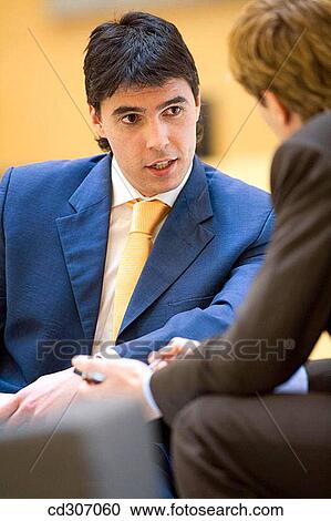 Stock Image - business, businesspeople, businessman, 30's. Fotosearch