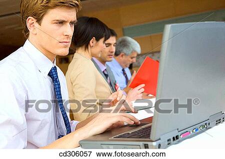 Stock Photo - business, businesspeople, businessman, 30's. Fotosearch