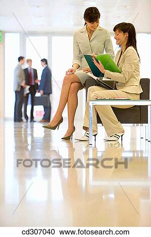 Stock Image - business, businesspeople, businesswoman, chair. Fotosearch