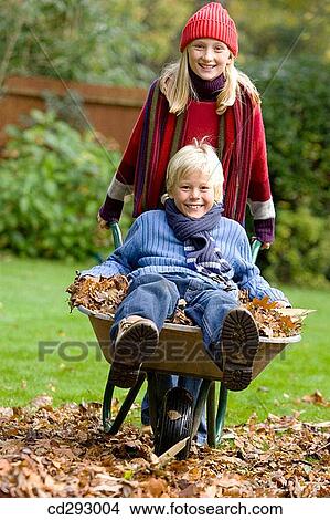 cap, autumn, brother, boy, barrow, amusement View Large Photo Image Picture - cap, autumn, brother, boy, barrow, amusement. Fotosearch