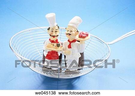 Chef figurines on strainer View Large Photo Image Stock Photo - Chef figurines on strainer. Fotosearch