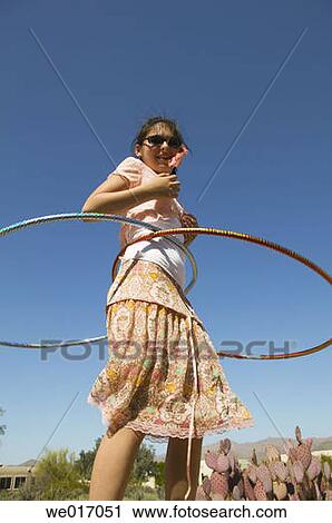 Child using hula-hoop View Large Photo Image Stock Image - Child using hula-hoop. Fotosearch