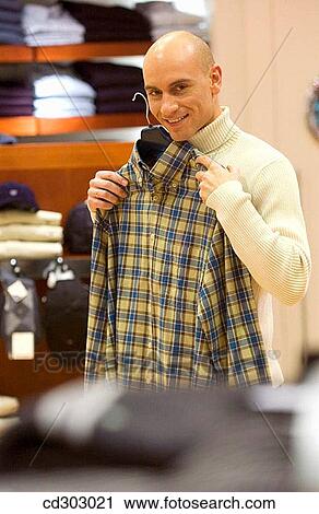 Stock Image - choice, Clothing store, choosing, 30's. Fotosearch