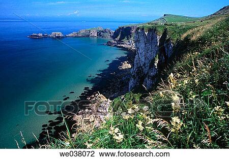 Cliff scenic in the road to Carrick-a-Rede Rope Bridge. Close to Ballintoy. Northern Ireland. View Large Photo Image Stock Image - Cliff scenic in the road to Carrick-a-Rede Rope Bridge. Close to Ballintoy. Northern Ireland.. Fotosearch