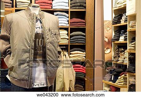 Stock Image - clothes, Clothing store, commerce, concept, contemporary. Fotosearch