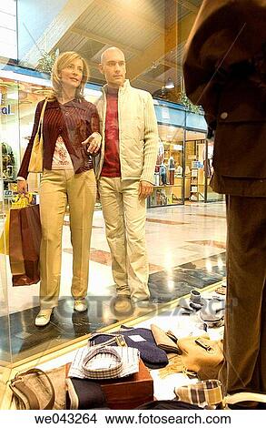 Clothing store, contemporary, couple View Large Photo Image Picture - Clothing store, contemporary, couple. Fotosearch