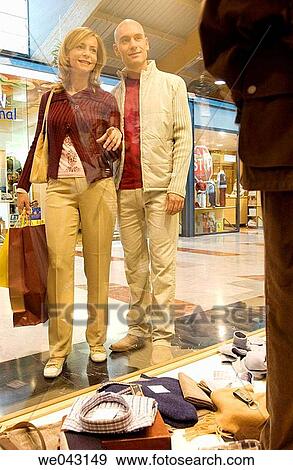 Clothing store, contemporary, couple View Large Photo Image Stock Photo - Clothing store, contemporary, couple. Fotosearch
