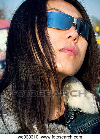 Cool Chinese girl wearing shades. View Large Photo Image Stock Image - Cool Chinese girl wearing shades.. Fotosearch