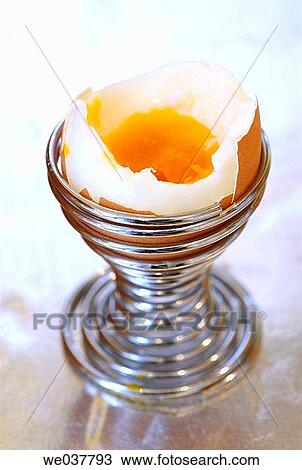 Egg in eggcup View Large Photo Image Stock Image - Egg in eggcup. Fotosearch
