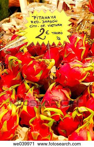 Stock Image - Exotic fruits. Dragon fruits from Vietnam. Boquer? a market. Barcelona. Catalunya. Spain.. Fotosearch