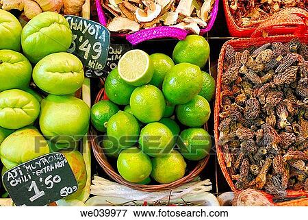 Fruits, limes and chayotes, and dried mushrooms. La Boquer? a market. Barcelona. Catalunya. Spain. View Large Photo Image Stock Photo - Fruits, limes and chayotes, and dried mushrooms. La Boquer? a market. Barcelona. Catalunya. Spain.. Fotosearch