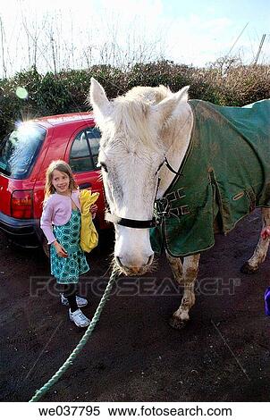 Girl child with horse View Large Photo Image Stock Photography - Girl child with horse. Fotosearch