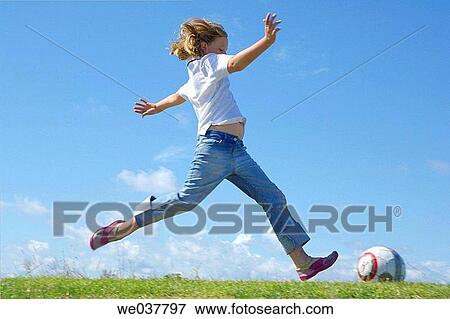 Girl running along seaside kicking View Large Photo Image Stock Photo - Girl running along seaside kicking. Fotosearch