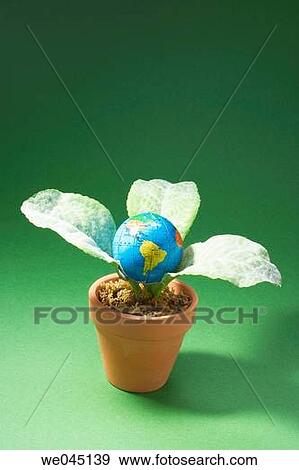 Globe and artificial pot plant View Large Photo Image Stock Photo - Globe and artificial pot plant. Fotosearch