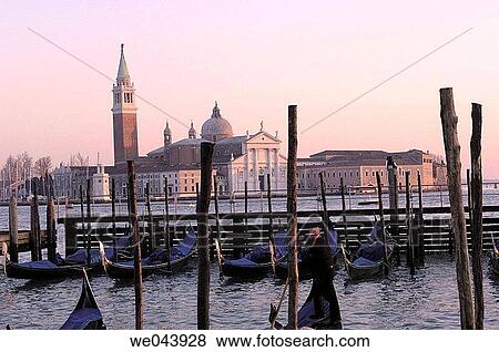 Gondolas at Piazzette San Marco pier and San Giorgio Maggiore in background, Venice. Veneto, Italy View Large Photo Image Stock Photo - Gondolas at Piazzette San Marco pier and San Giorgio Maggiore in background, Venice. Veneto, Italy. Fotosearch