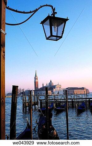 Gondolas at Piazzette San Marco pier and San Giorgio Maggiore in background, Venice. Veneto, Italy View Large Photo Image Stock Photo - Gondolas at Piazzette San Marco pier and San Giorgio Maggiore in background, Venice. Veneto, Italy. Fotosearch