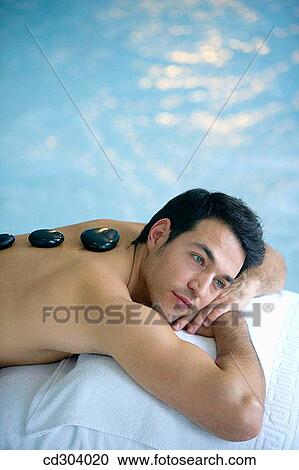 Hot stone massage. Thalassotherapy Zelai, Zumaia, Gipuzkoa, Basque Country View Large Photo Image Stock Image - Hot stone massage. Thalassotherapy Zelai, Zumaia, Gipuzkoa, Basque Country. Fotosearch