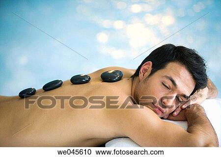 Hot stone massage. Thalassotherapy Zelai, Zumaia, Gipuzkoa, Basque Country View Large Photo Image Stock Image - Hot stone massage. Thalassotherapy Zelai, Zumaia, Gipuzkoa, Basque Country. Fotosearch