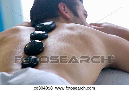 Hot stone massage. Thalassotherapy Zelai, Zumaia, Gipuzkoa, Basque Country View Large Photo Image Stock Photo - Hot stone massage. Thalassotherapy Zelai, Zumaia, Gipuzkoa, Basque Country. Fotosearch