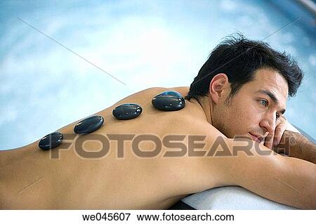 Hot stone massage. Thalassotherapy Zelai, Zumaia, Gipuzkoa, Basque Country View Large Photo Image Stock Photo - Hot stone massage. Thalassotherapy Zelai, Zumaia, Gipuzkoa, Basque Country. Fotosearch