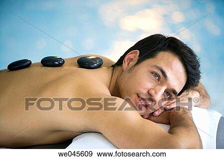 Hot stone massage. Thalassotherapy Zelai, Zumaia, Gipuzkoa, Basque Country View Large Photo Image Stock Photo - Hot stone massage. Thalassotherapy Zelai, Zumaia, Gipuzkoa, Basque Country. Fotosearch