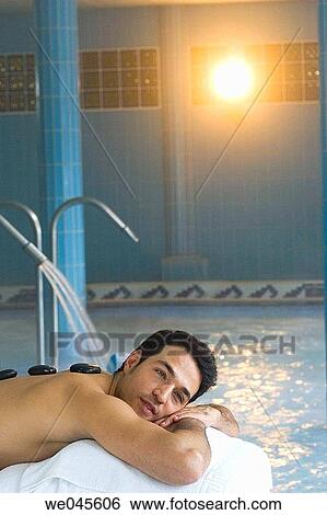 Stock Photograph - Hot stone massage. Thalassotherapy Zelai, Zumaia, Gipuzkoa, Basque Country. Fotosearch