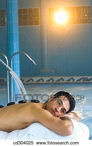 Hot stone massage. Thalassotherapy Zelai, Zumaia, Gipuzkoa, Basque Country View Large Photo Image Stock Photography - Hot stone massage. Thalassotherapy Zelai, Zumaia, Gipuzkoa, Basque Country. Fotosearch