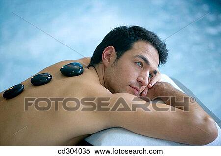 Hot stone massage. Thalassotherapy Zelai, Zumaia, Gipuzkoa, Basque Country View Large Photo Image Stock Photography - Hot stone massage. Thalassotherapy Zelai, Zumaia, Gipuzkoa, Basque Country. Fotosearch