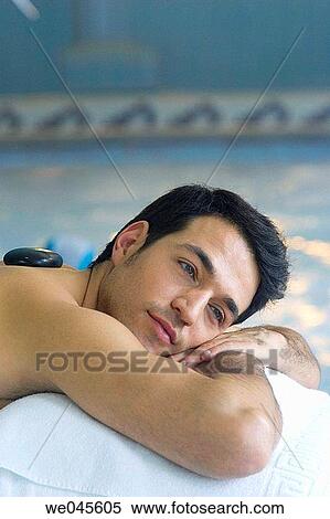 Stock Photography - Hot stone massage. Thalassotherapy Zelai, Zumaia, Gipuzkoa, Basque Country. Fotosearch