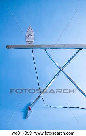 Iron and ironing board View Large Photo Image Stock Photo - Iron and ironing board. Fotosearch