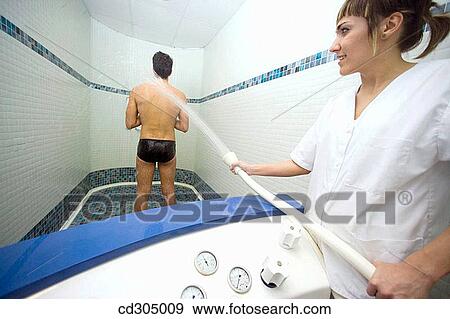 Jet Shower. Invigorating water massage to relieve specific areas of sore or tight muscles View Large Photo Image Stock Photo - Jet Shower. Invigorating water massage to relieve specific areas of sore or tight muscles. Fotosearch