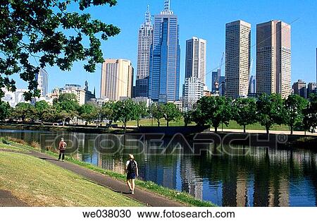 Joggers beside Yarra river with Melbourne Central Business District. Victoria. Australia. View Large Photo Image Stock Image - Joggers beside Yarra river with Melbourne Central Business District. Victoria. Australia.. Fotosearch