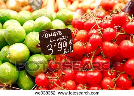 Limes and cherry tomatoes at La Boquer? a market, Barcelona. Catalonia, Spain View Large Photo Image Stock Image - Limes and cherry tomatoes at La Boquer? a market, Barcelona. Catalonia, Spain. Fotosearch
