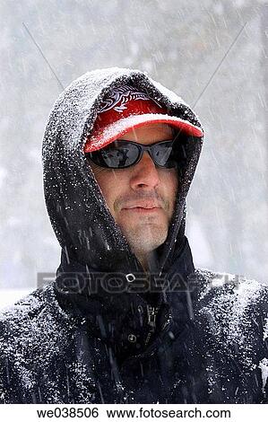 Man standing in snow View Large Photo Image Stock Photograph - Man standing in snow. Fotosearch