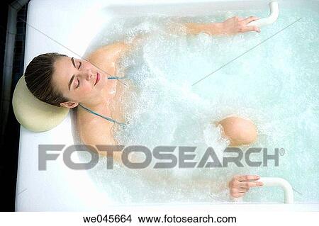 Picture - Multijet Jacuzzi with algae. Rich in iodine, minerals and trace elements. Stimulates the circulation and relaxes the muscles.. Fotosearch