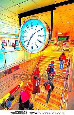 People and clock in the metro station of Pla? a Catalunya, Barcelona. Catalonia, Spain View Large Photo Image Stock Photo - People and clock in the metro station of Pla? a Catalunya, Barcelona. Catalonia, Spain. Fotosearch