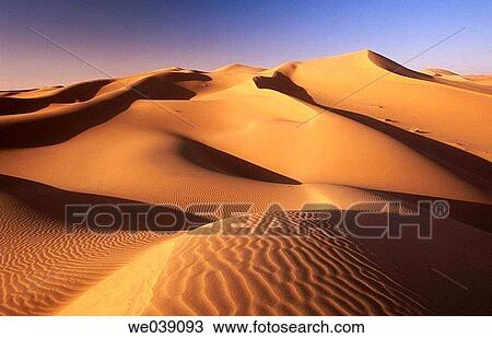 Stock Image - Sand dunes, desert. Sahara, Grand Erg Oriental. Algeria.. Fotosearch
