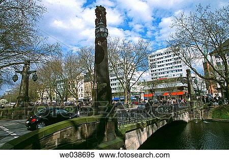 Stock Photography - Springtime view of K÷nigsallee, D? sseldorf's elegant shopping boulevard, affectionately referred to as the? K÷?. D? sseldorf. North Rhine-Westphalia. Germany. Fotosearch