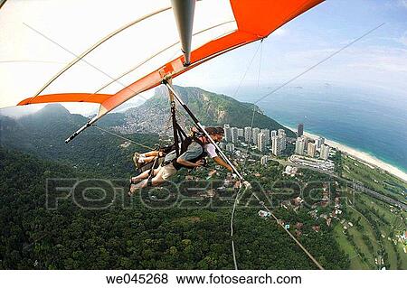Tandem hangliders, taking off from Pedro Bonita mountain, landing on Pepino Beach, South end of Rio de Janiero, Brazil View Large Photo Image Stock Photo - Tandem hangliders, taking off from Pedro Bonita mountain, landing on Pepino Beach, South end of Rio de Janiero, Brazil. Fotosearch
